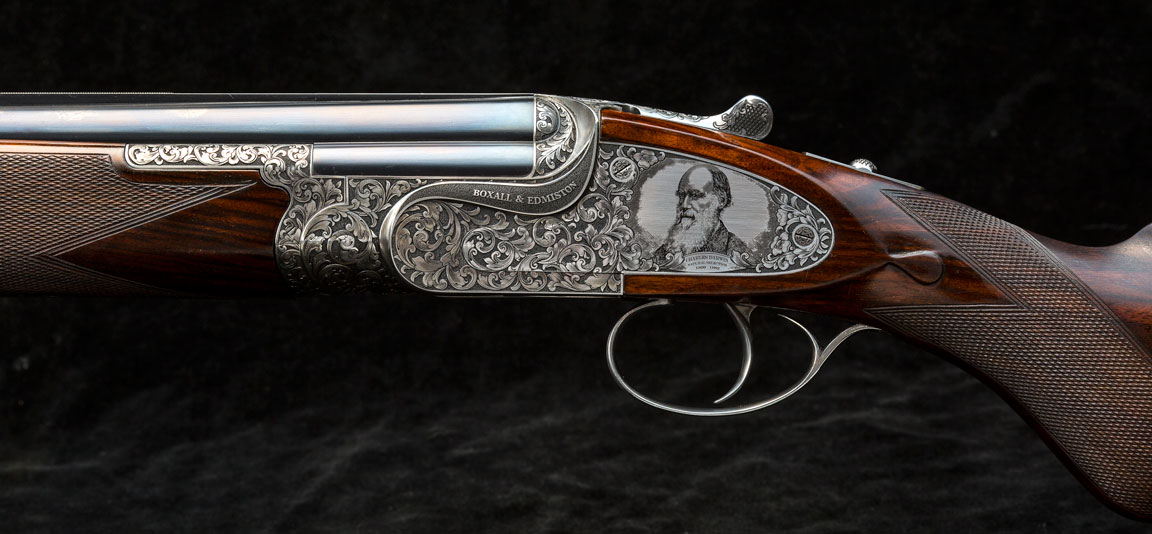Darwin-engraved-onto-sideplated-over-and-under-Boxall-and-Edmiston-shotgun-British-made-bespoke Darwin-engraved-onto-sideplated-over-and-under-Boxall-and-Edmiston-shotgun-British-made-bespoke